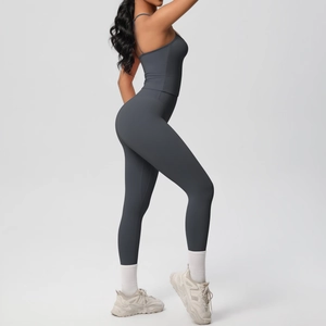 Close-up of a high-waisted dark grey yoga set featuring a camisole top and leggings