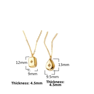 Detail of 18K gold plated stainless steel pendants with star engraving and zircon stone