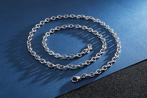 Close-up of silver stainless steel O-chain necklace with a secure lobster clasp