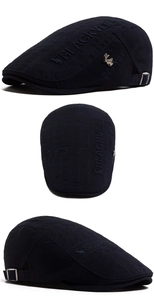 Detailed close-up of dark blue cotton flat cap with 3D embroidery and metal bunny logo