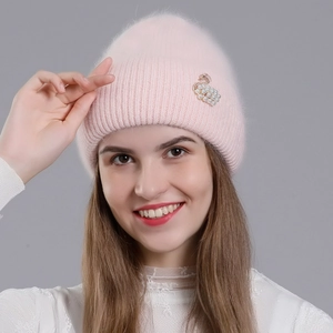 Pink rabbit fur knit hat for women featuring a luxury pearl swan brooch for winter warmth