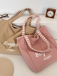 Dual-sided canvas tote bag with plush lining and Bonjour Magic print in pink and khaki