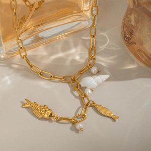 Elegant gold necklace with conch shell, koi fish charms and natural freshwater pearls