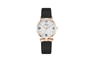 Detail of a ladies watch with rose gold case, rhinestone markers, and black leather strap