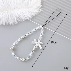 Handmade phone strap featuring white pearls, silver bows and clear beads, length 20cm