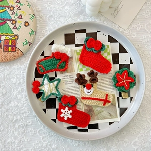 Handmade crochet Christmas hair clips set featuring Santa socks and reindeer designs