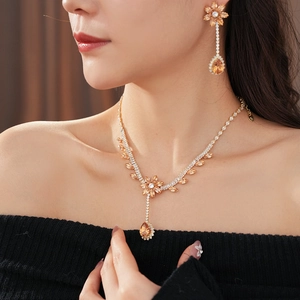 Detail of luxury zircon flower jewelry set with champagne crystals and teardrop pendants