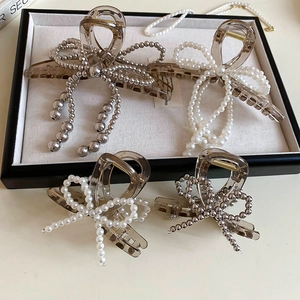Elegant tortoiseshell acrylic bow hair clips with imitation pearls in a gift tray