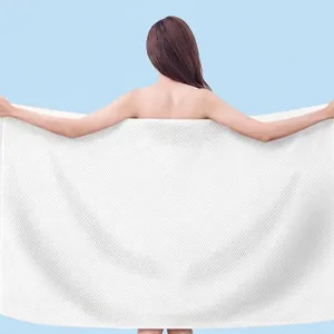 Extra large white disposable cotton bath towel for travel with full body coverage