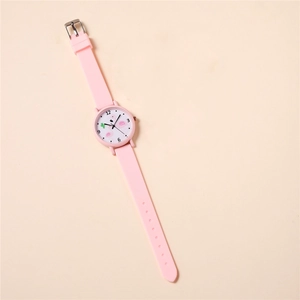 Detailed view of pink kids' quartz watch with flamingo pattern and silicone strap