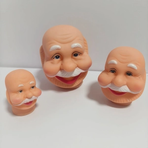 Detailed comparison of three different sizes of vinyl Santa Claus head models for DIY crafts