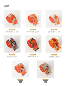 Close-up of 6.3cm wide autumn ribbons with pumpkin, maple leaf and plaid patterns