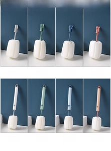 Close-up of detachable sponge cup brushes and replacement heads in various pastel colors