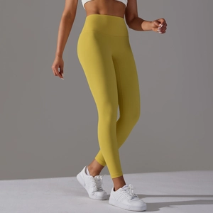 Vue détaillée du legging de yoga jaune gingembre à taille haute gainante et sans couture