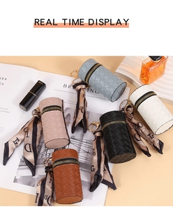 Detail view of woven leather coin purses in five colors with decorative silk scarves