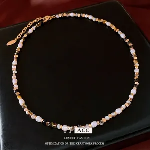 Maillard style freshwater pearl and dark faceted gemstone necklace with gold accents