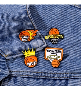 Detailed enamel basketball pins on denim jacket featuring GAME TIME and MVP text
