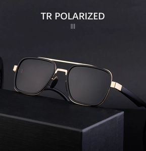 Detail of polarized sunglasses with black and gold TR90 frame on professional display box