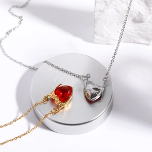 Magnetic heart pendant necklaces in gold and silver with red crystal and wings