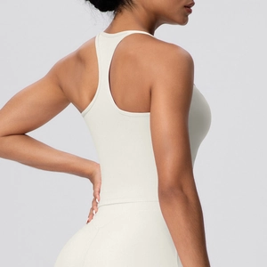 Close-up of racerback yoga tank top with flatlock seams in premium cream matte fabric