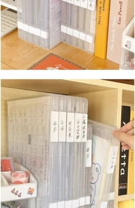 Detail of transparent A4 file storage box with side index label slots for desktop organizing