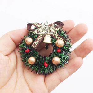 Miniature Christmas wreath with golden bells and Merry Christmas ribbon for dollhouse decor