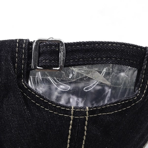 Detailed macro view of dark blue denim baseball cap with an adjustable silver metal buckle