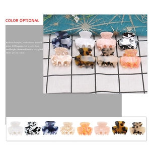 Mini acetate hair claws in various patterns including marble and tortoiseshell patterns