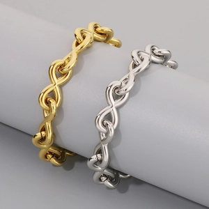 Infinity symbol chain bracelet in gold and silver finish on a display stand