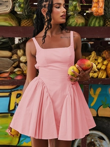 Detail of pink sleeveless mini dress with ruffles and backless design on a model