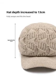 Detail of light brown knitted beanie with 13cm depth measurement and warm curved brim