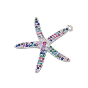 Macro shot of silver starfish pendant set with vibrant blue, green, and pink zircons