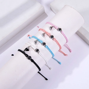 Minimalist braided couple bracelets with heart magnets and projection beads in five colors