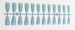 Detail of 24 pieces light blue glossy long square press-on nails on storage strip