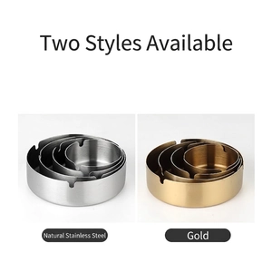 Durable round stainless steel ashtrays in gold and silver finishes with cigarette slots