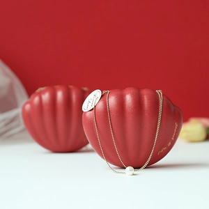 Shell shaped red matte wedding candy box with pearl and golden chain decoration
