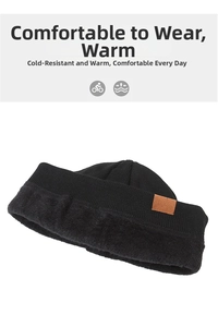 Detail of black knitted beanie showing thick thermal faux fur lining and leather patch