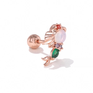 Macro shot of rose gold fish ear bone stud with opal head and colorful zircon detailing