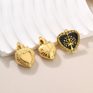 Set of three classic gold heart pendants featuring butterfly and tree of life motifs