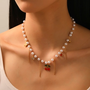 Elegant pearl chain necklace with cherry, butterfly, and rhinestone heart pendants