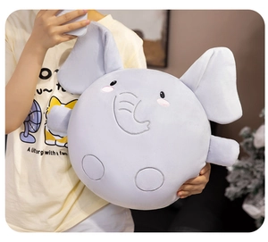 Close-up of a soft round blue elephant plush toy featuring fine embroidered facial details