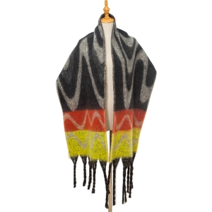 Detailed close-up of thick mohair-like scarf showing zigzag pattern and long tassel fringe