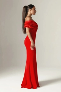 Detail of red off-shoulder evening dress featuring side slit and elegant satin drape
