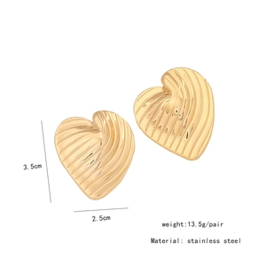 Macro view of gold heart earrings showing 3.5cm dimension and stainless steel texture