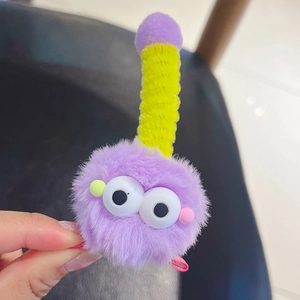 Pince à cheveux monstre en peluche violette avec yeux mobiles et antenne rayée