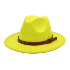 Detail of a bright yellow fedora hat with a brown faux leather belt and metal buckle