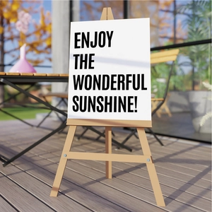 Close-up of 3-inch waterproof letter stickers on poster with wooden easel in the sun