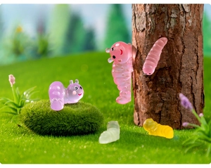 Detailed view of colorful resin luminous caterpillar figurines for micro landscapes