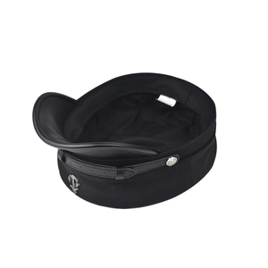 Close-up of black wool captain hat with leather visor, silver buttons and anchor badge