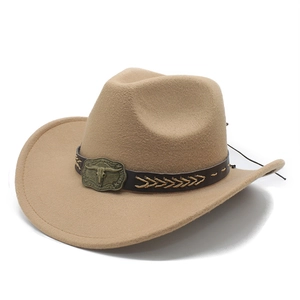 Detail of tan felt cowboy hat featuring leather band and vintage bronze steer skull buckle